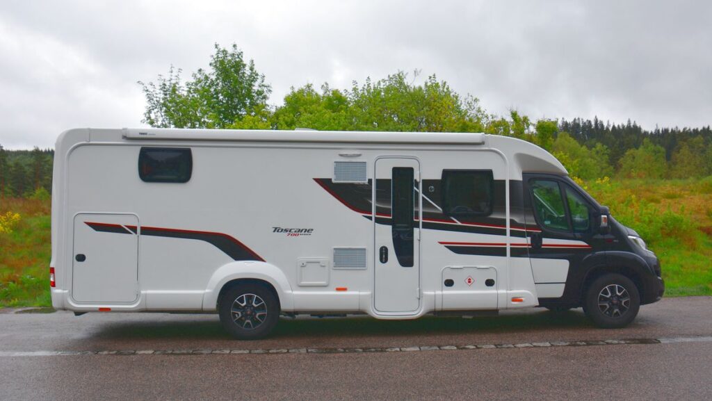 Motorhome seen from the side, with ventilation grilles visible